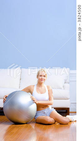 Young Woman with Exercise Ball 3824500