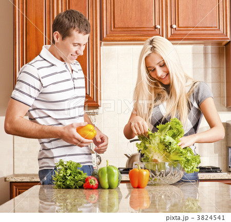 Young Couple Making Salad Young Couple Making Salad 3824541