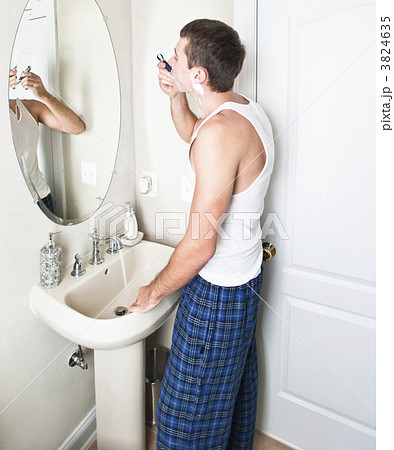 Young Man in Bathroom Shaving 3824635