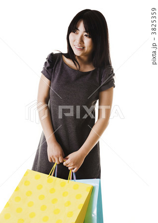 Chinese woman holding shopping bags. 3825359