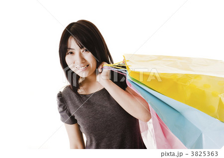 Chinese woman holding shopping bags. 3825363