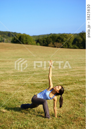 Girl Practicing Yoga In Field Girl Practicing Yoga In Field 3825630