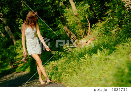 Pretty girl on forest path 3825732
