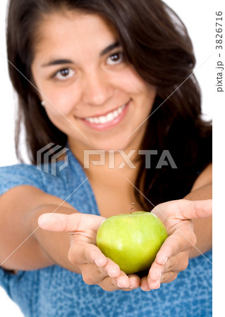 girl offering a green apple girl offering a green apple 3826716