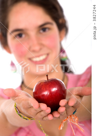 girl offering an apple girl offering an apple 3827244