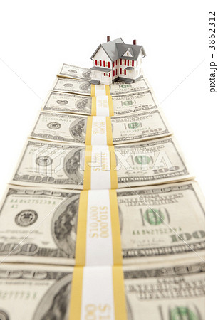 Small House on Row of Hundred Dollar Bill Stacks 3862312