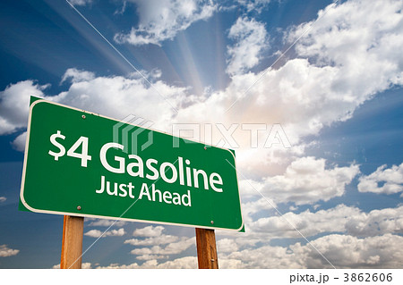$4 Gasonline Green Road Sign and Clouds 3862606