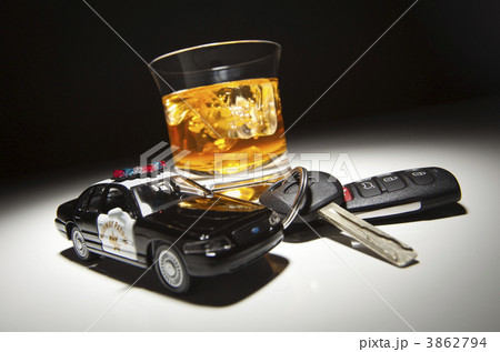 Highway Patrol Police Car Next to Alcoholic Drink and Keys Highway Patrol Police Car Next to Alcoholic Drink and Keys 3862794
