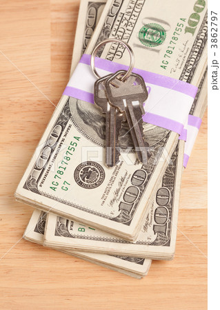House Keys on Stack of Money 3862797