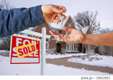 Handing Over the House Keys in Front of New Home Handing Over the House Keys in Front of New Home 3862802