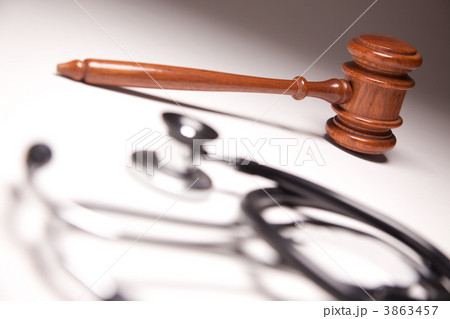 Gavel and Stethoscope on Gradated Background Gavel and Stethoscope on Gradated Background 3863457
