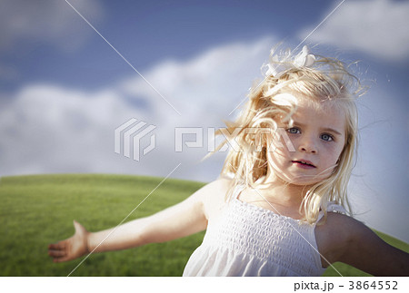 Adorable Blue Eyed Girl Playing Outside 3864552