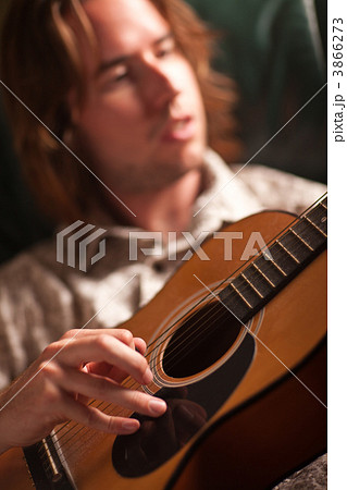Young Musician Plays His Acoustic Guitar Young Musician Plays His Acoustic Guitar 3866273