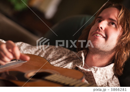 Young Musician Plays His Acoustic Guitar 3866281