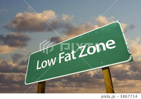 Low Fat Zone Green Road Sign and Clouds 3867714