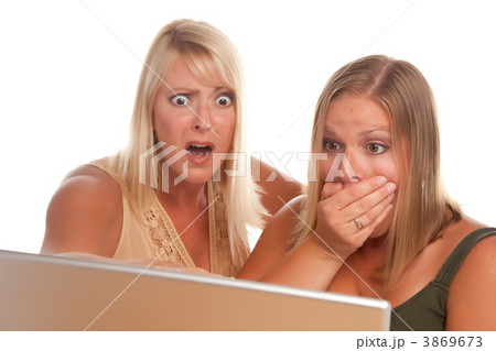 Two Shocked Women Using Laptop Two Shocked Women Using Laptop 3869673