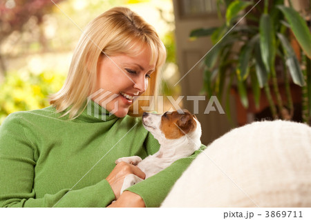 Woman and Puppy Enjoying Their Day on The Sofa Woman and Puppy Enjoying Their Day on The Sofa 3869711