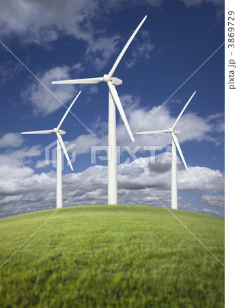 Wind Turbines Over Grass Field, Dramatic Sky and Clouds Wind Turbines Over Grass Field, Dramatic Sky and Clouds 3869729