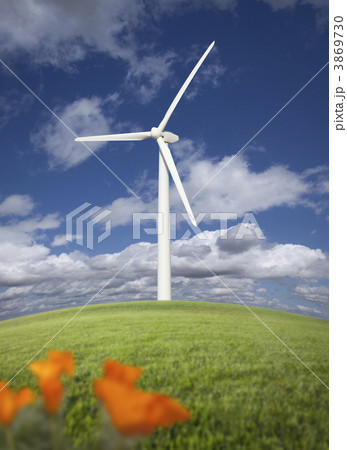 Wind Turbine Against Dramatic Sky and California Poppies . Wind Turbine Against Dramatic Sky and California Poppies . 3869730