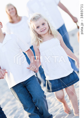 Adorable Little Girl Walking With Her Family 3869731