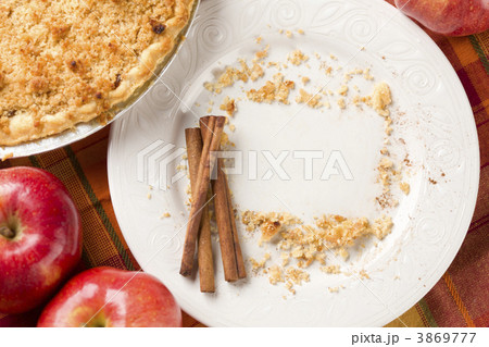 Pie, Apples, Cinnamon Sticks and Copy Spaced Crumbs on Plate 3869777