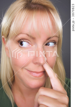 Blond Woman with Finger in Her Nose 3870823