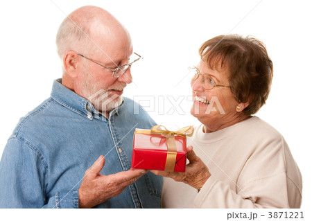 Happy Senior Couple with Gift 3871221