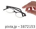 眼鏡を取ろうとする手 3872153