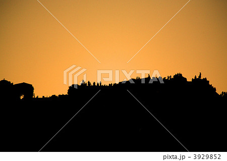 People silhouetted against the sunset People silhouetted against the sunset 3929852