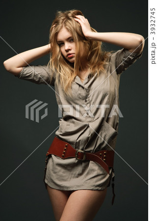 Seductive fashion portrait of young woman on dark background 3932745