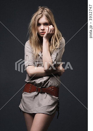 Fashion portrait of seductive blond girl on dark background 3932747