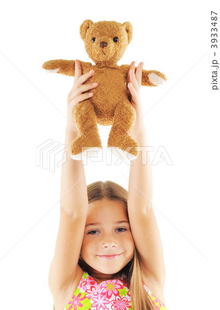 Little girl playing with bear toy 3933487
