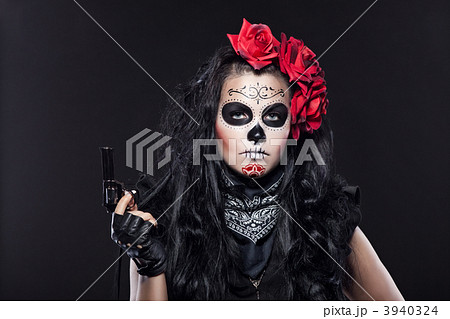 Serious woman in day of the dead mask portrait 3940324