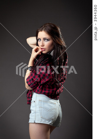 Young girl in red shirt look at camera 3944360