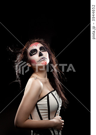 Depressed Young woman in day of the dead mask 3944652