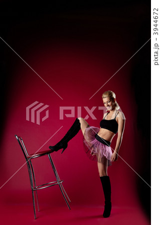 young woman in dance sport costume kick chair young woman in dance sport costume kick chair 3944672