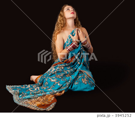 Beauty girl sit in indian costume with passion Beauty girl sit in indian costume with passion 3945252