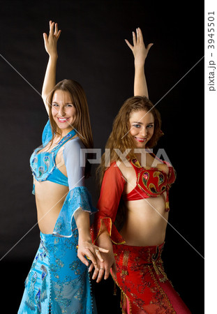 Two young woman dance and smile 3945501