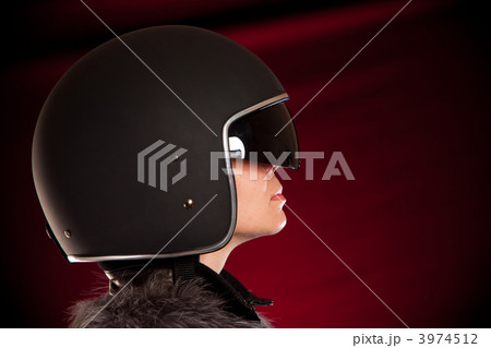 Biker girl in a helmet Biker girl in a helmet 3974512