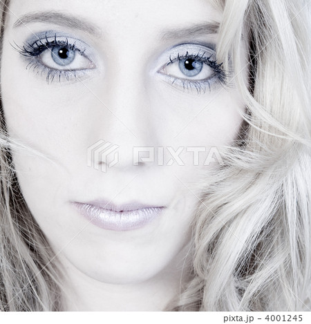 Studio portrait of a long blond girl looking hurt Studio portrait of a long blond girl looking hurt 4001245