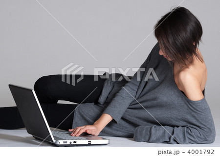 Young woman on floor with notebook Young woman on floor with notebook 4001792