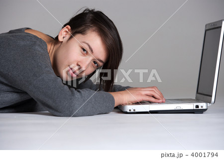 Young woman on floor with notebook Young woman on floor with notebook 4001794