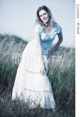 Young woman on a summer field Young woman on a summer field 4002073