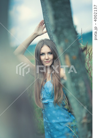 Young woman outdoors calm portrait Young woman outdoors calm portrait 4002137