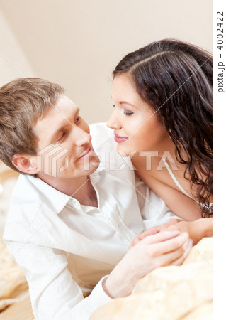 Young couple on a bed 4002422