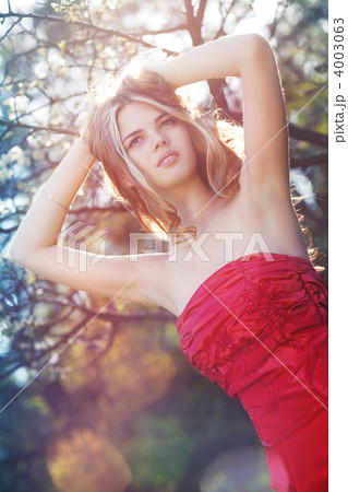 Young woman with cherry tree Young woman with cherry tree 4003063