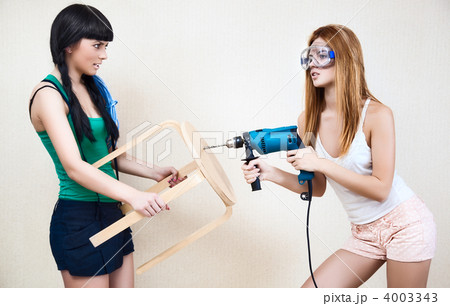 Young women repairing stool 4003343