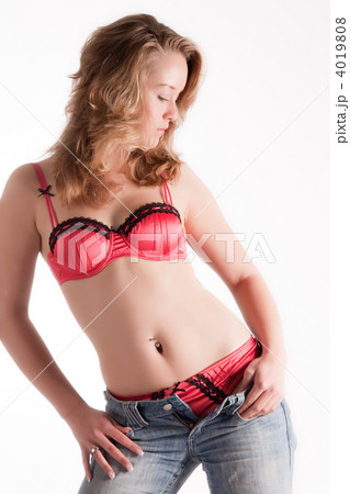 Undressing woman in red lingerie and jeans only 4019808
