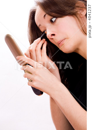 Cosmetic girl touching her eyes 4041237