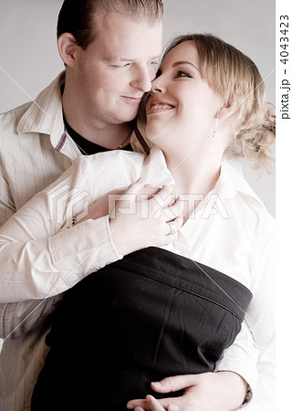 Portrait of a young loving couple holding hands Portrait of a young loving couple holding hands 4043423
